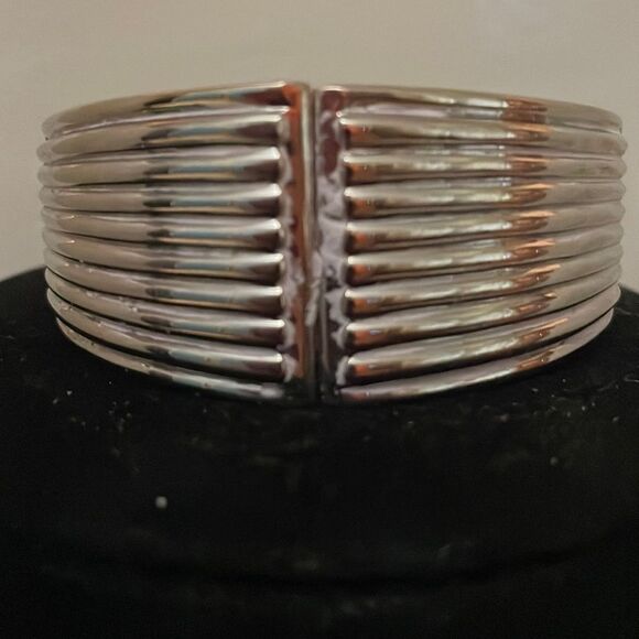 2.5” x 1” hinged silver tone 10 layer textured interior angled cuff bracelet - Picture 1 of 10